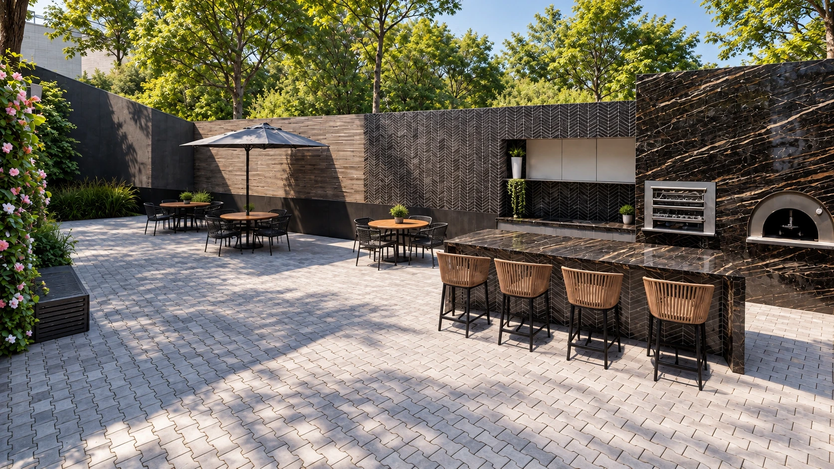 Espaço gourmet externo com bancada de pedra, churrasqueira e forno.